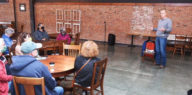 Democratic Iowa-4th congressional district candidate JD Scholten speaks during the " Coffee with the Candidate" event at Farm Ground Coffee Saturday, Oct. 17, 2020, in Nevada, Iowa.